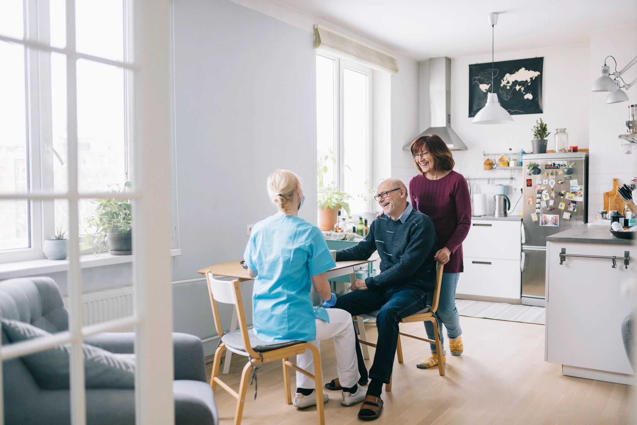 Caregiver visiting a senior couple at home