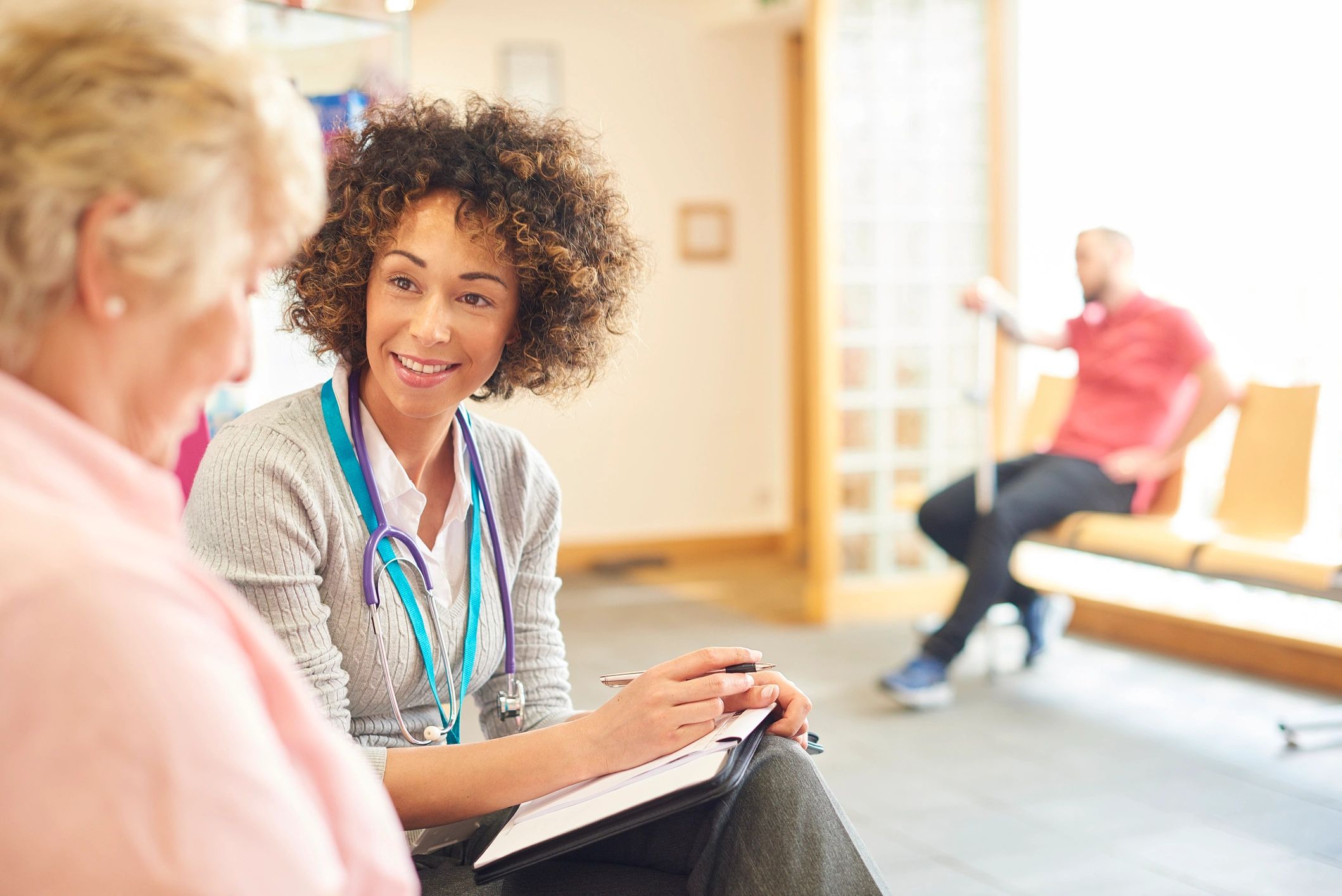 Senior chatting with a professional in a calm setting